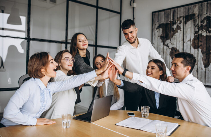 Group of people working out business plan in an office